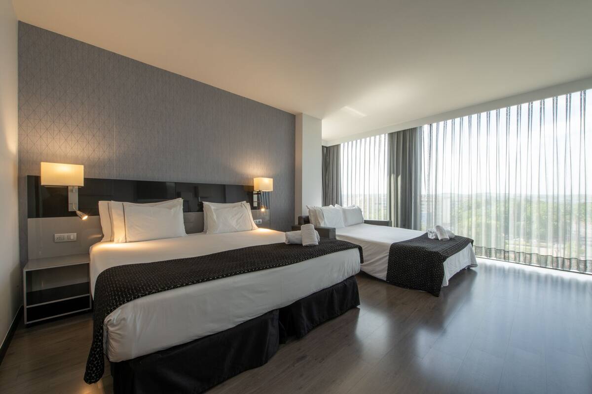 family room | 1 bedroom, minibar, in-room safe, desk