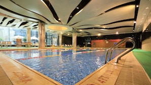 An indoor swimming pool with clear water, a no diving sign, and a lifeguard chair. - Four Points by Sheraton Beijing, Haidian (Beijing)