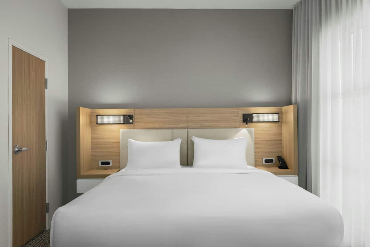 Premium bedding, pillow-top beds, desk, laptop workspace