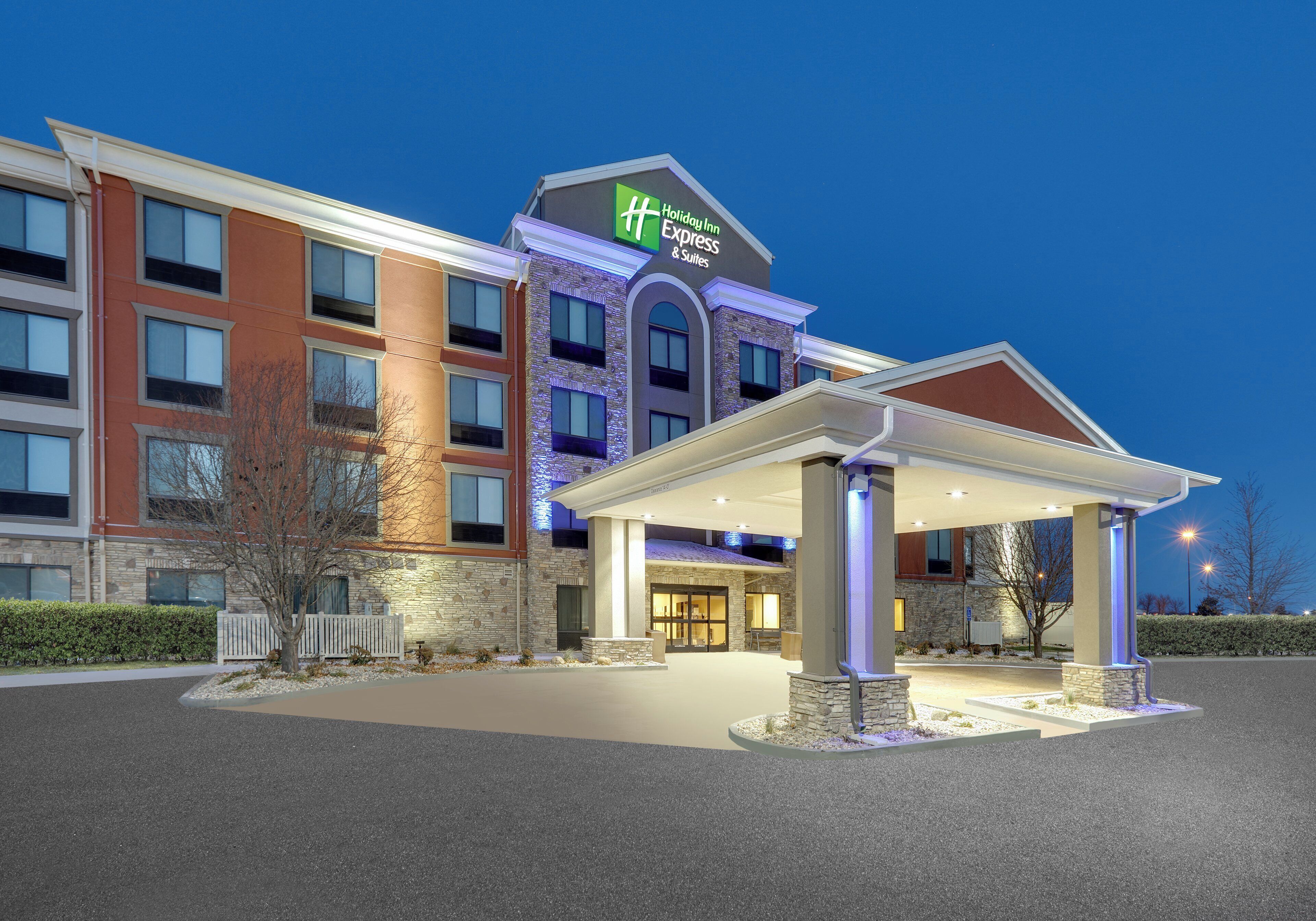A Holiday Inn Express hotel with a covered entrance and a stone facade.