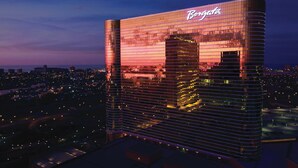 A high-rise building with a reflective glass facade and the name 'Borgata' prominently displayed. - MGM Tower at Borgata (Atlantic City)
