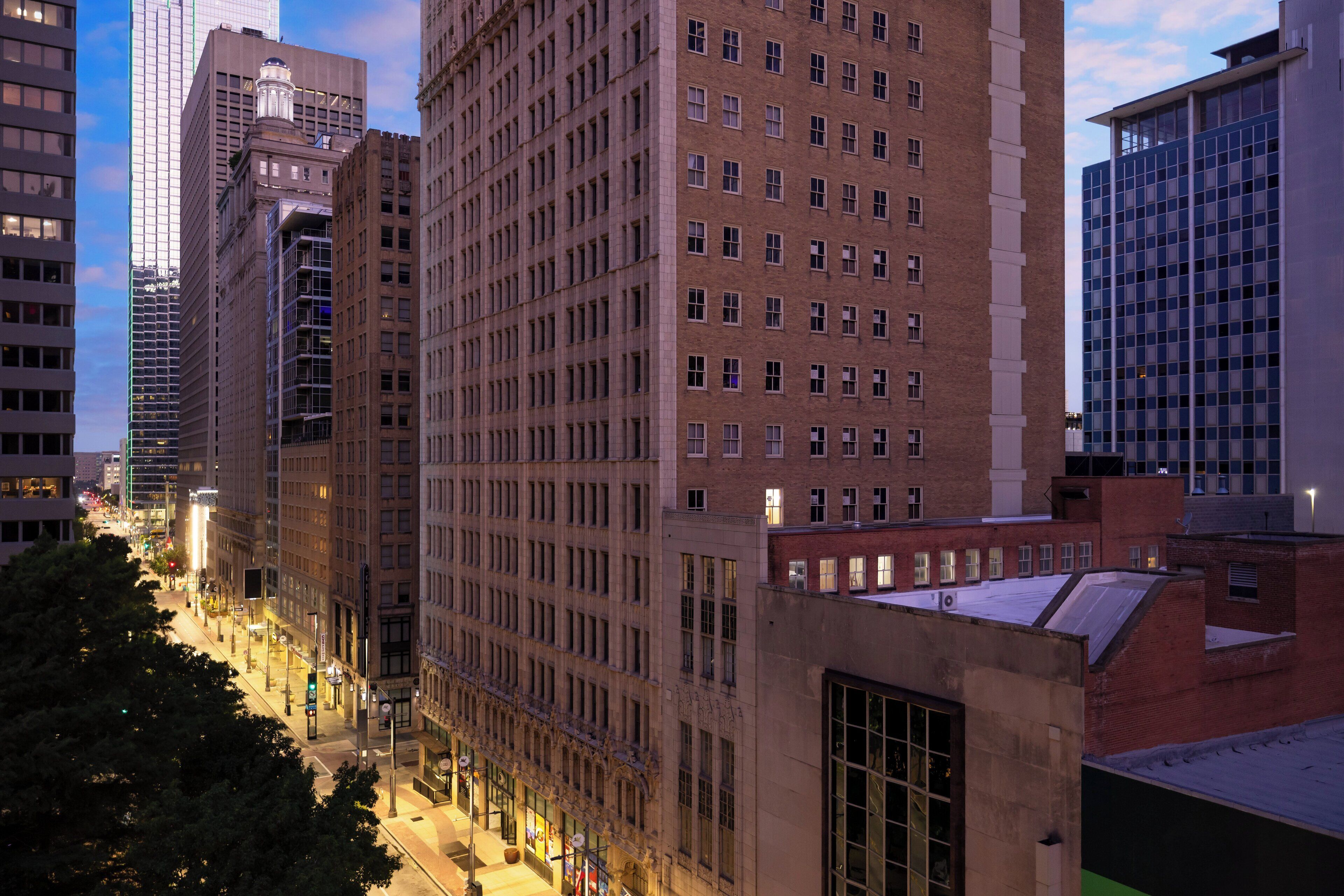A high-rise building with a grid of windows and a flat roof.