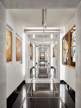 Stunning corridor with framed artworks and a large abstract painting. at The Joule