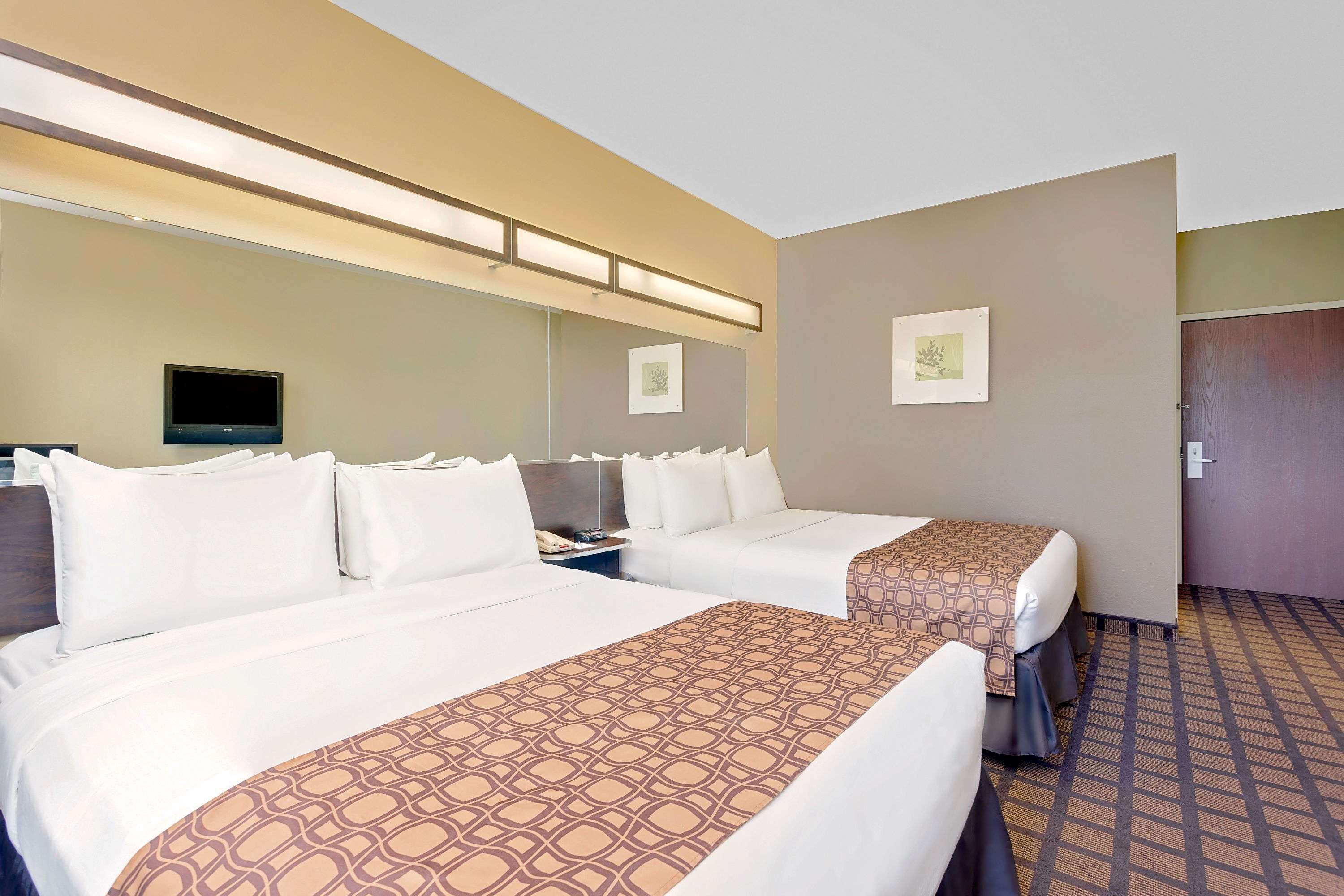 premium bedding, pillow-top beds, desk, blackout curtains