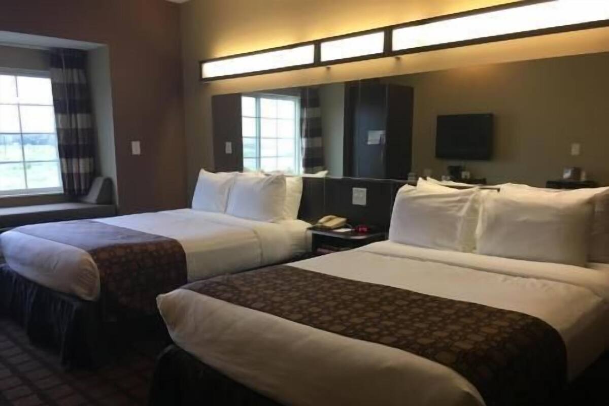 Premium bedding, pillowtop beds, desk, blackout drapes