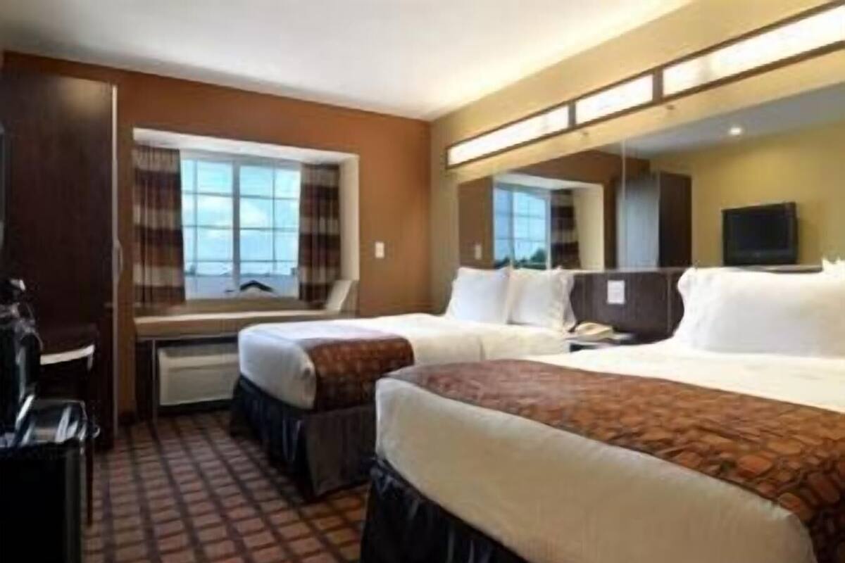 Premium bedding, pillowtop beds, desk, blackout drapes