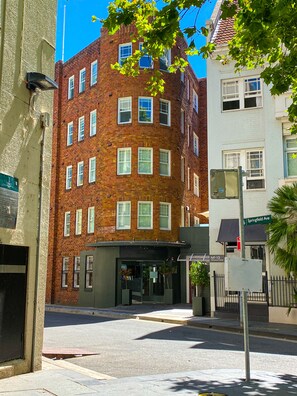 Stylish corner building with a storefront on the ground floor, offering a convenient location.