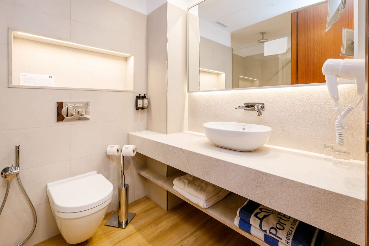 hair dryer, bidet, towels