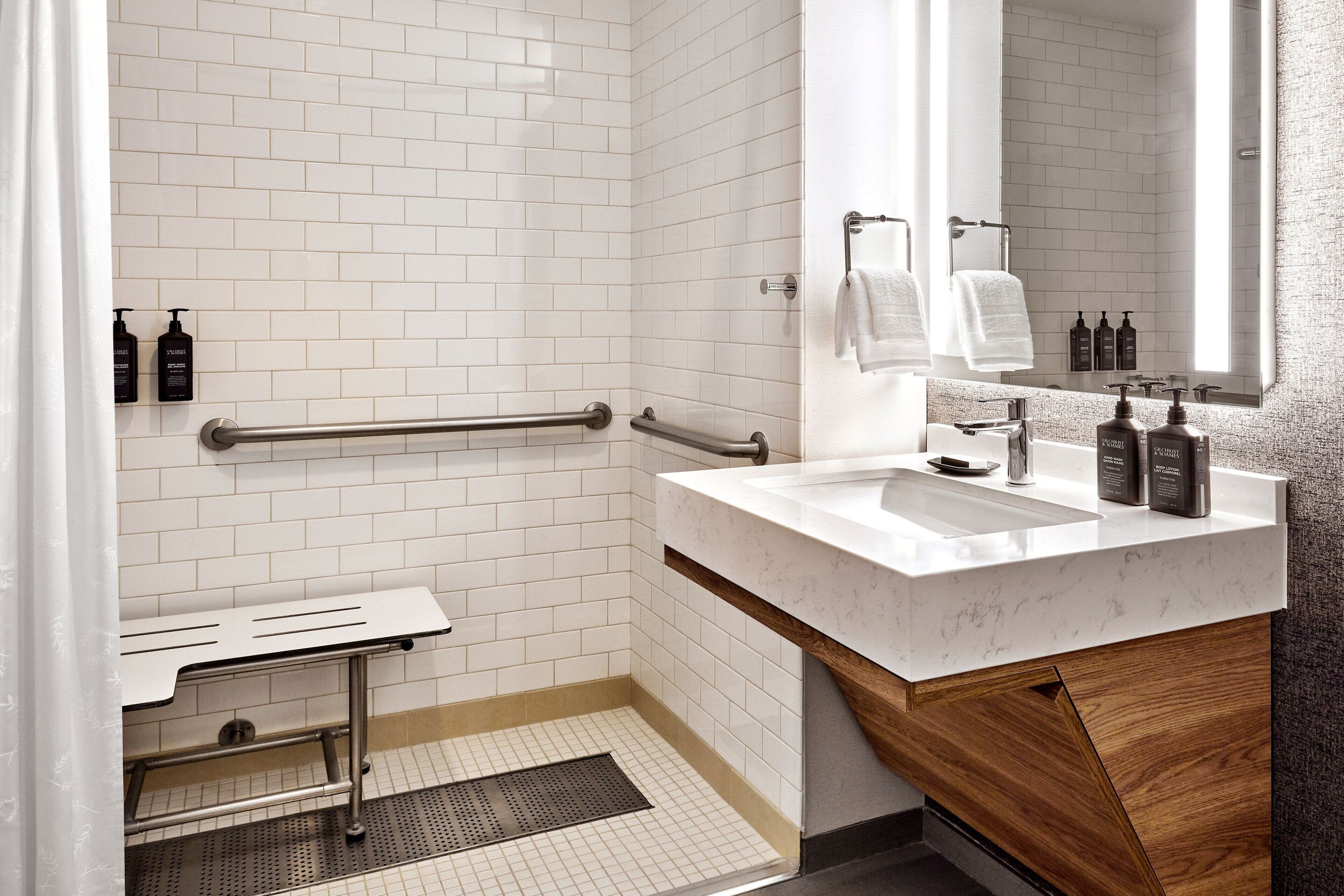 shower, designer toiletries, hair dryer, towels