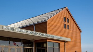 A wooden building with a sign reading "Harriet Tubman Underground Railroad Visitor Center".