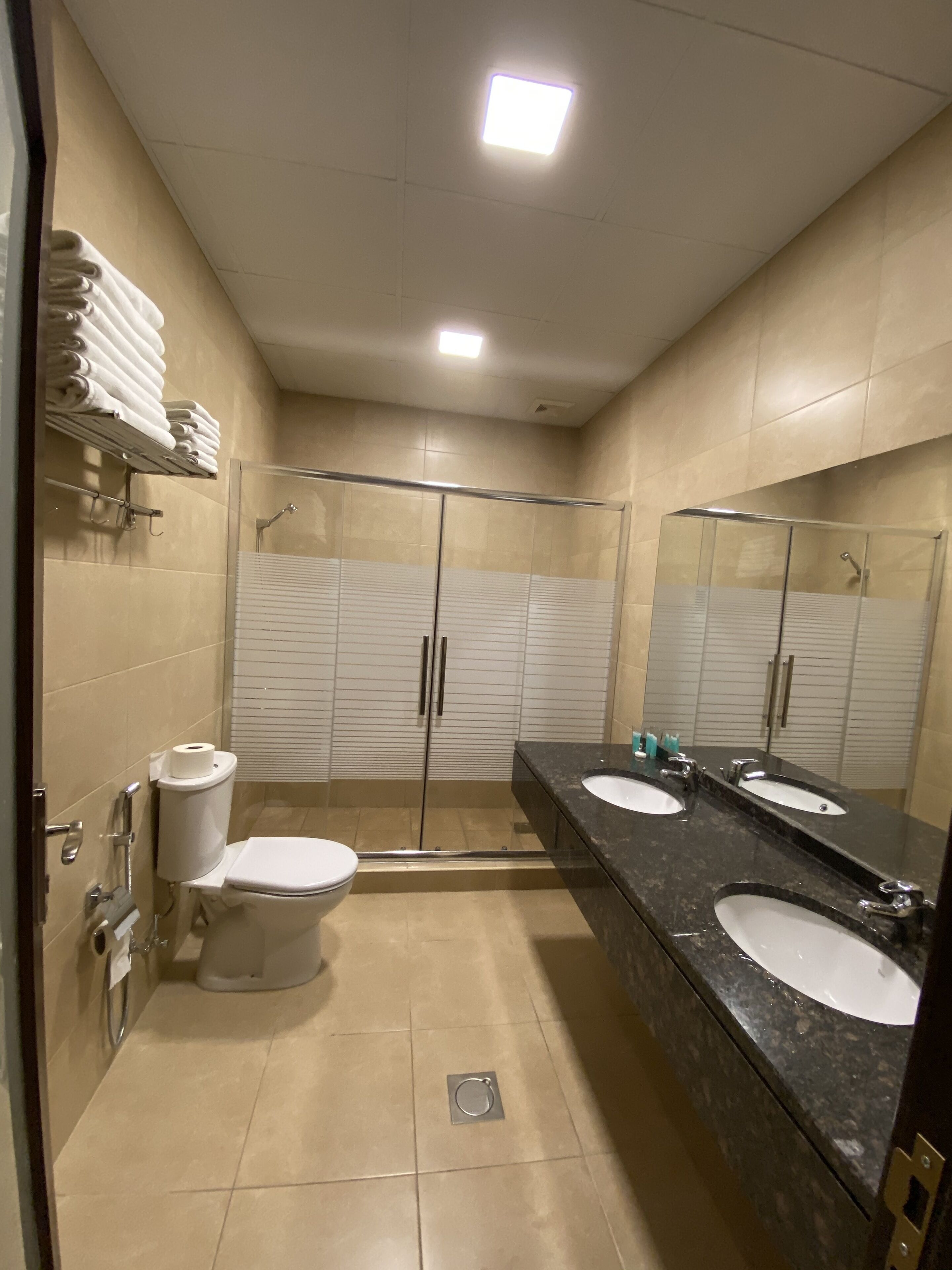 deluxe quadruple room | bathroom | shower, free toiletries, hair dryer, towels