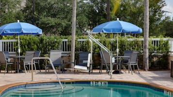 Outdoor pool, open 6:00 AM to 10:00 PM, pool loungers