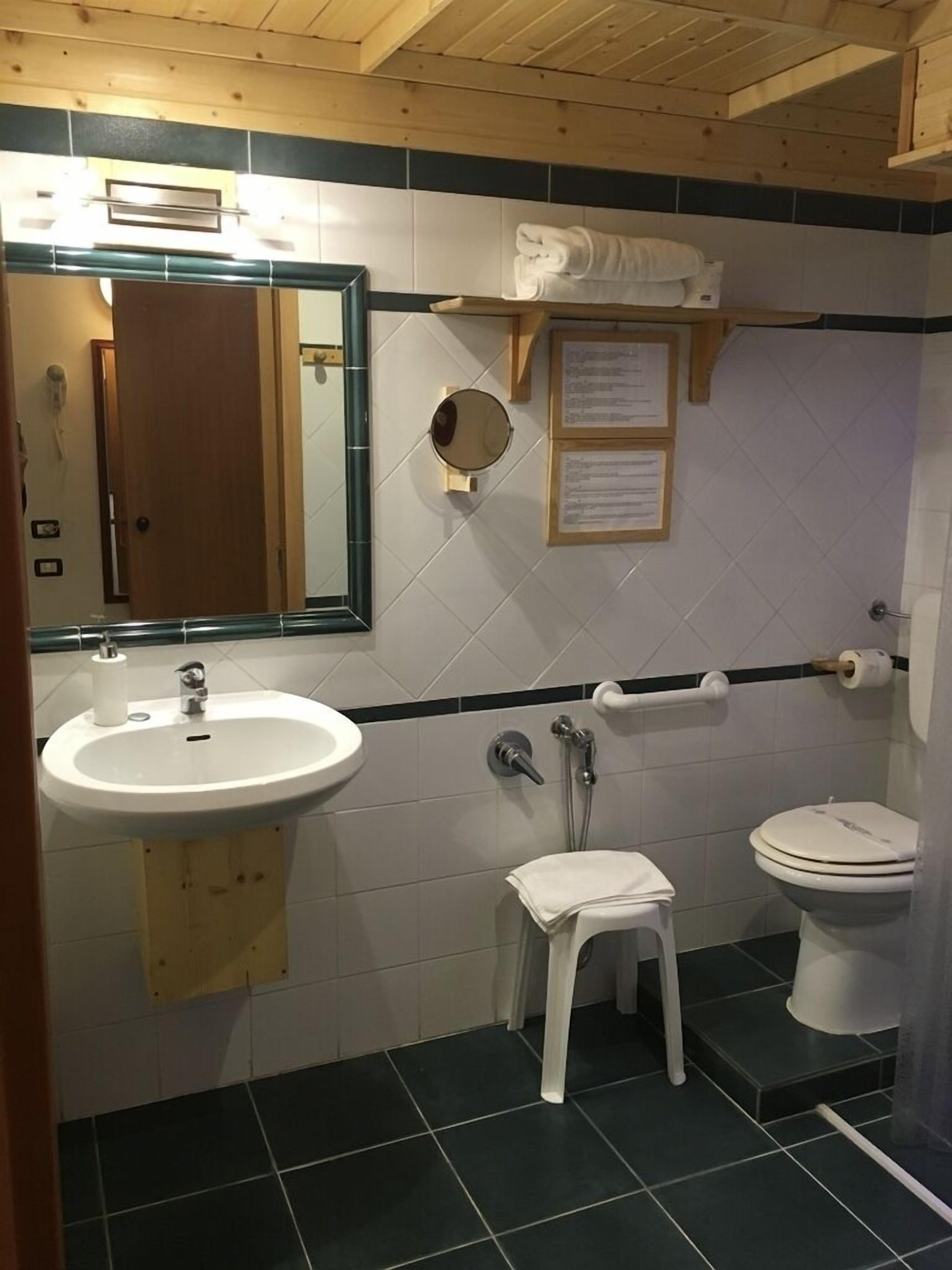 superior studio (4 people) | bathroom | shower, hair dryer, towels