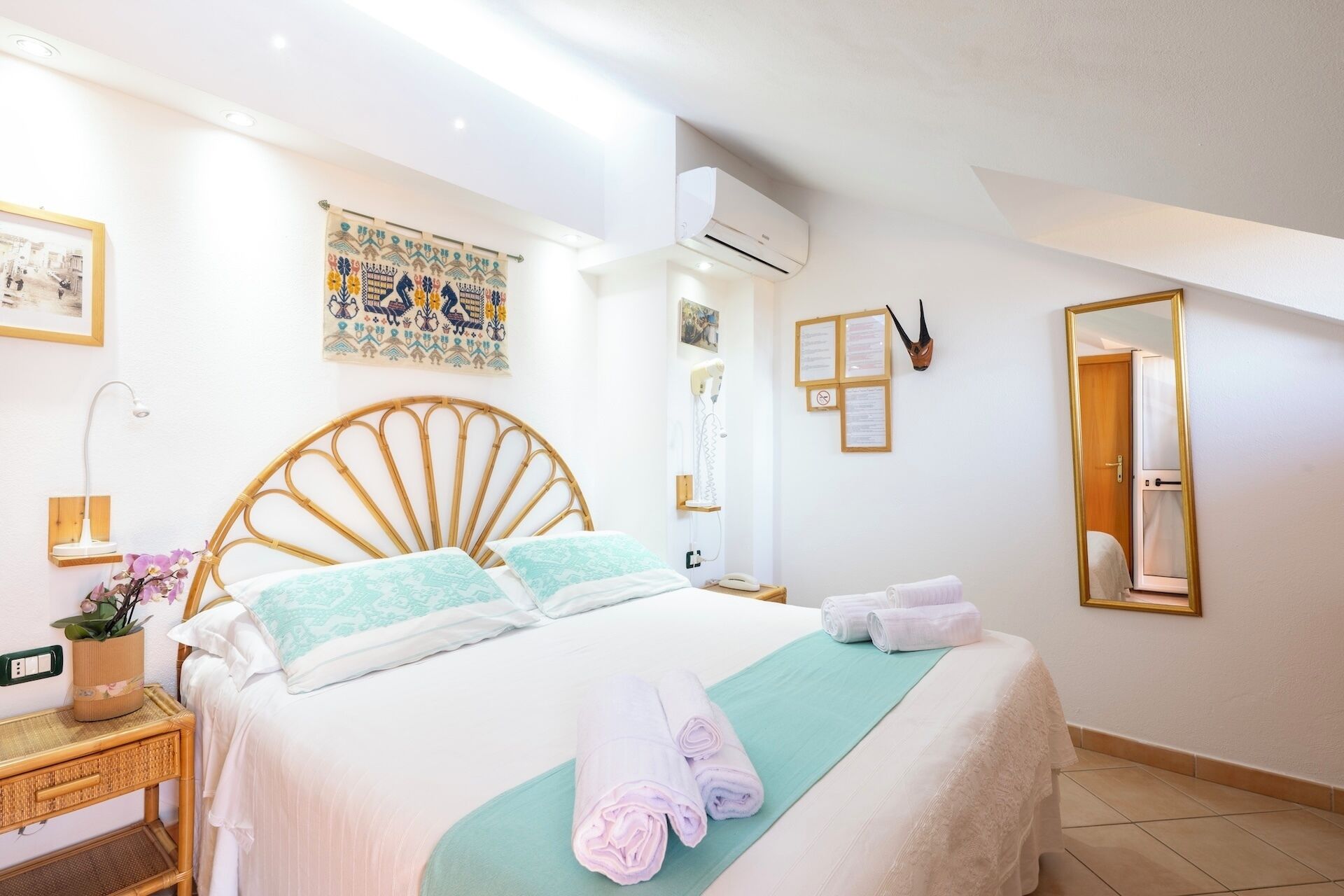 Basic Double Room, Private Bathroom (Mansard Small) | Minibar, in-room safe, individually decorated, individually furnished