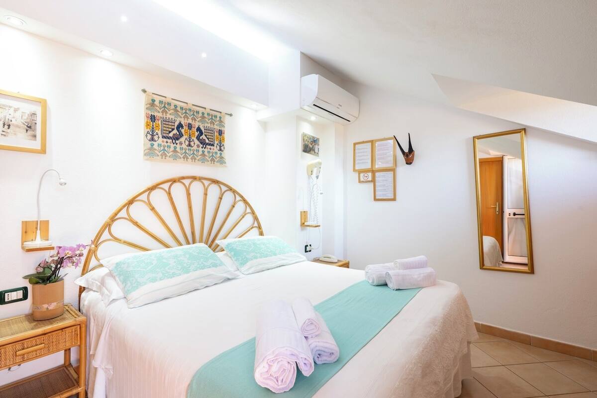 Basic Double Room, Private Bathroom (Mansard Small) | Minibar, in-room safe, WiFi (free), individually decorated