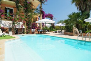 Seasonal outdoor pool, pool umbrellas, pool loungers