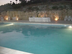 Seasonal outdoor pool, a rooftop pool, pool umbrellas, pool loungers