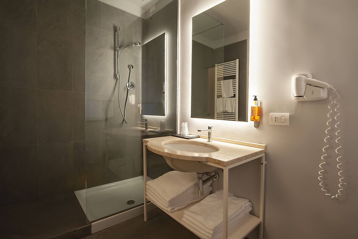 family room | bathroom | shower, free toiletries, hair dryer, bathrobes