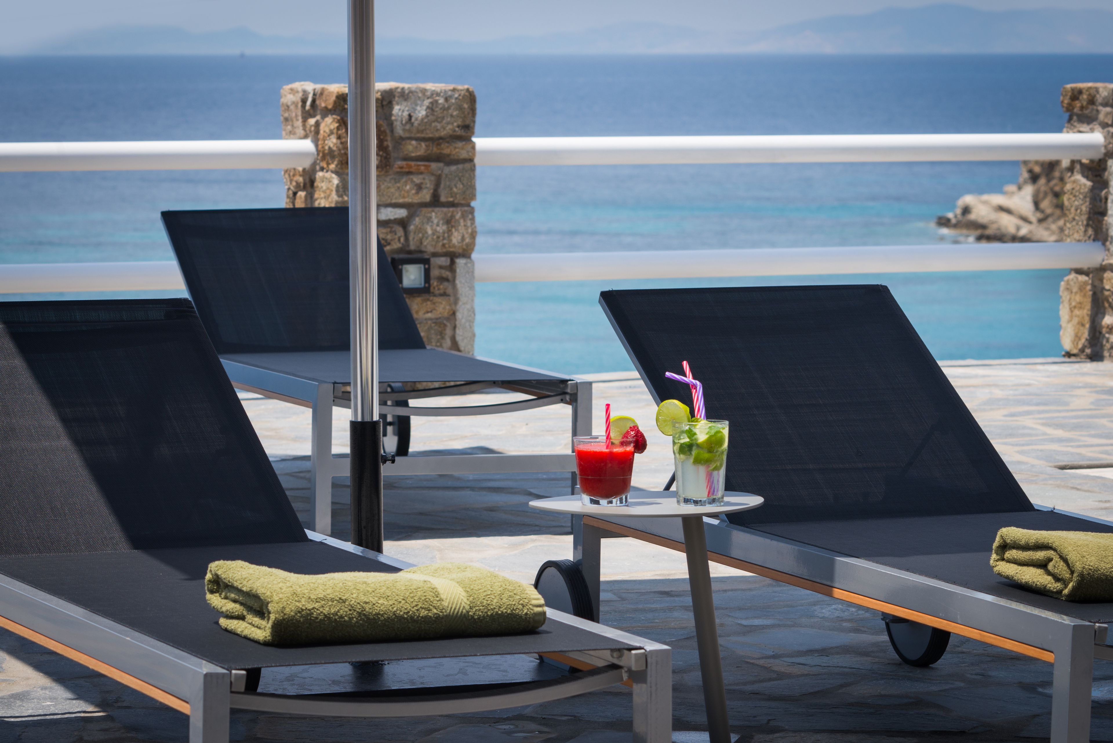 Seasonal outdoor pool, open 11:00 AM to 7:00 PM, pool umbrellas