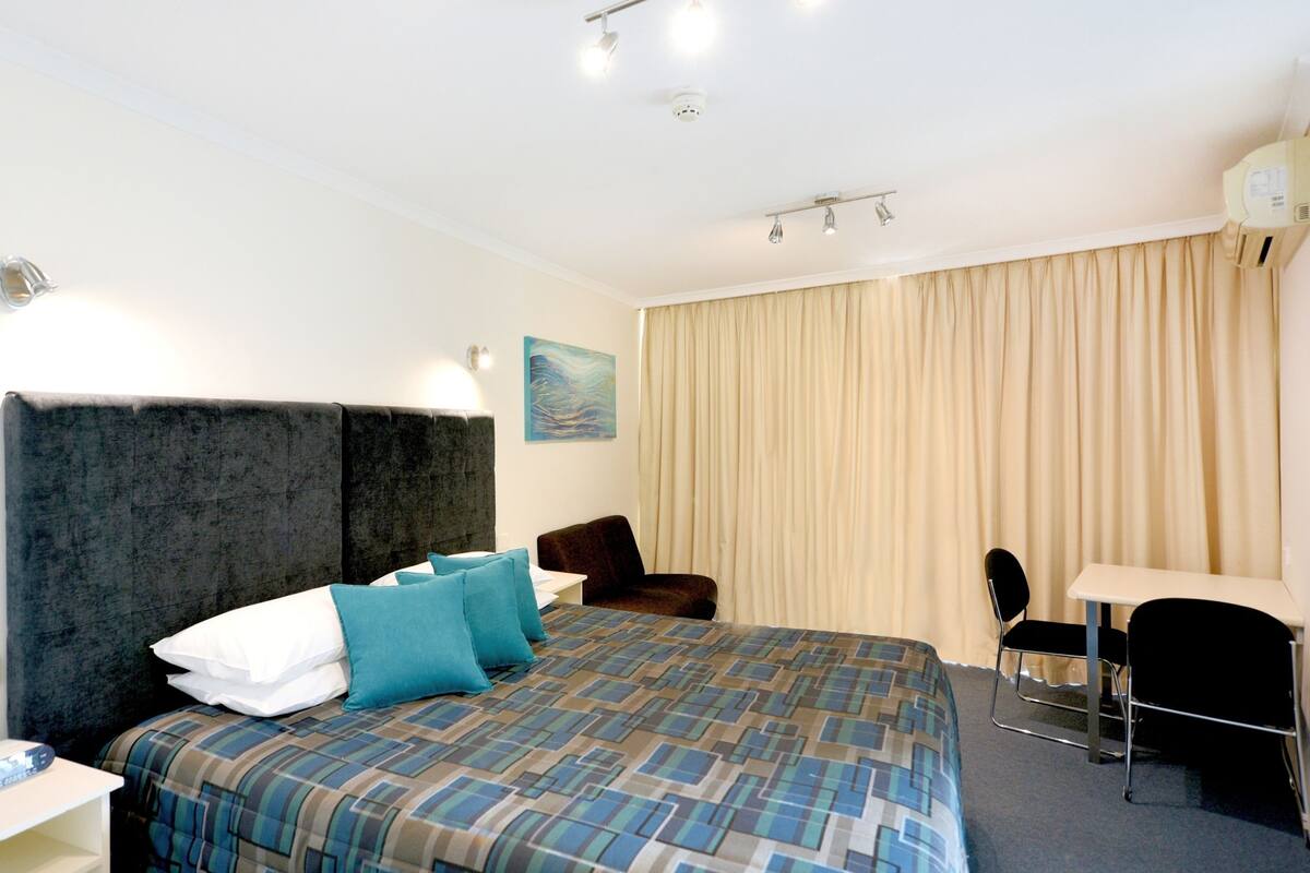 Minibar, desk, blackout drapes, iron/ironing board
