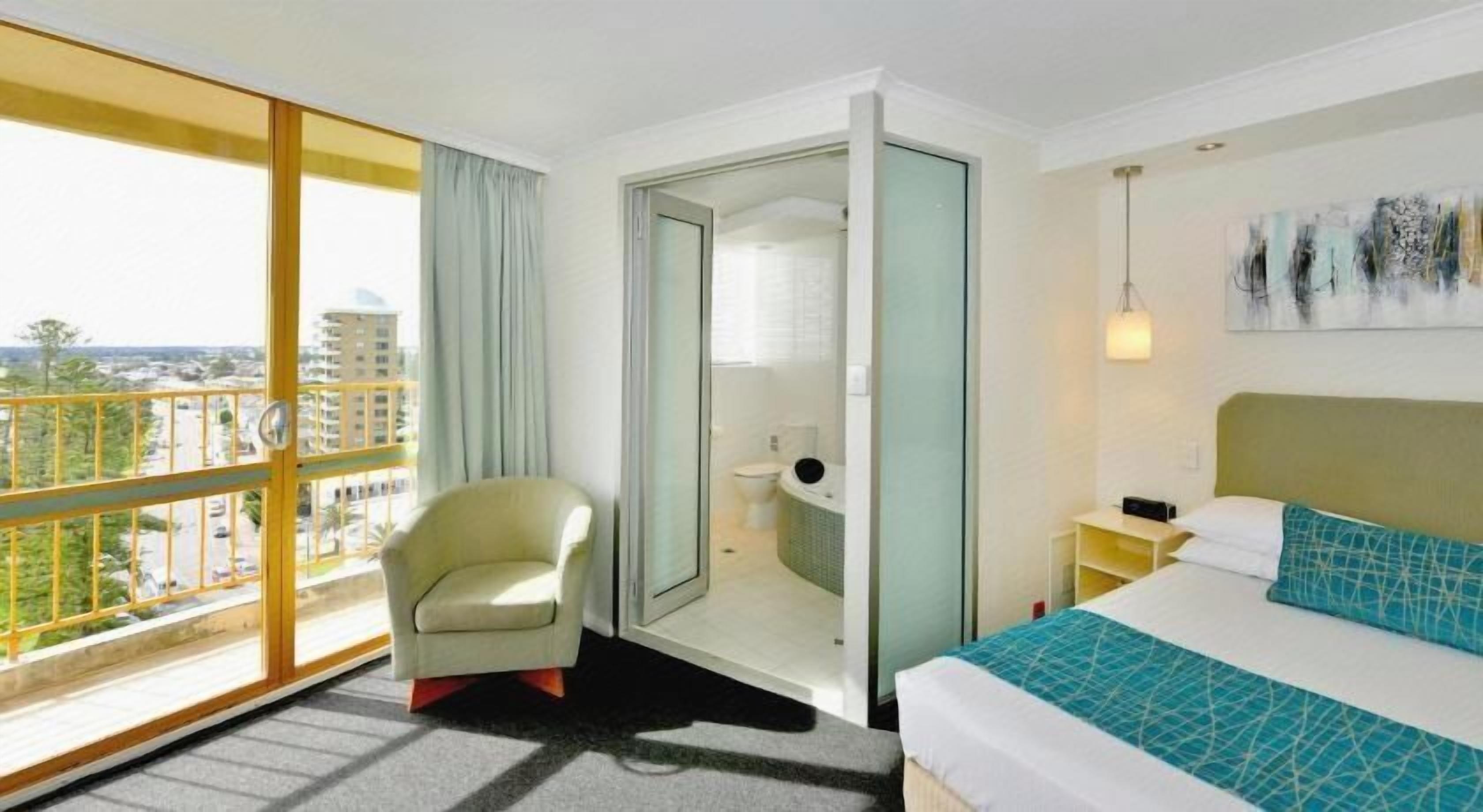 Minibar, desk, blackout curtains, iron/ironing board
