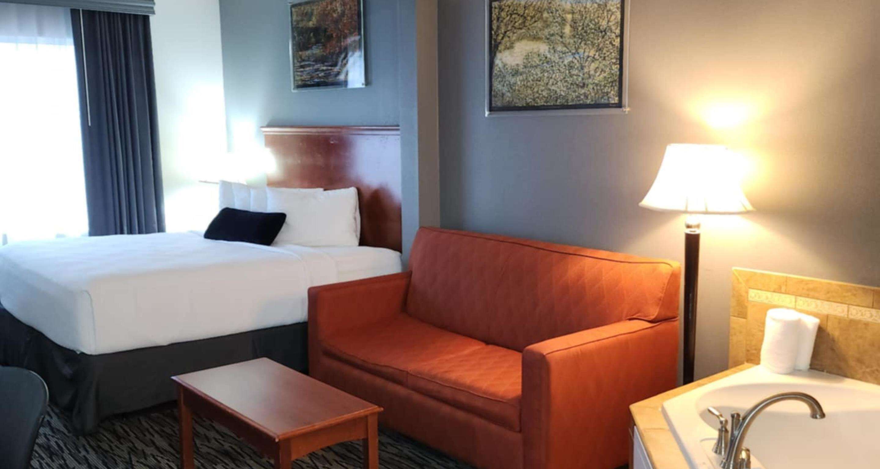 suite, 1 king bed, non smoking, jetted tub (with sofabed) | premium bedding, in-room safe, desk, laptop workspace