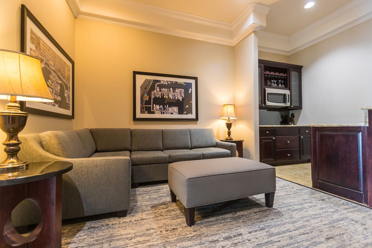 grand suite (two double beds) | living area | 42-inch lcd tv with digital channels, tv, dvd player