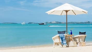 Private beach, white sand, sun loungers, beach umbrellas