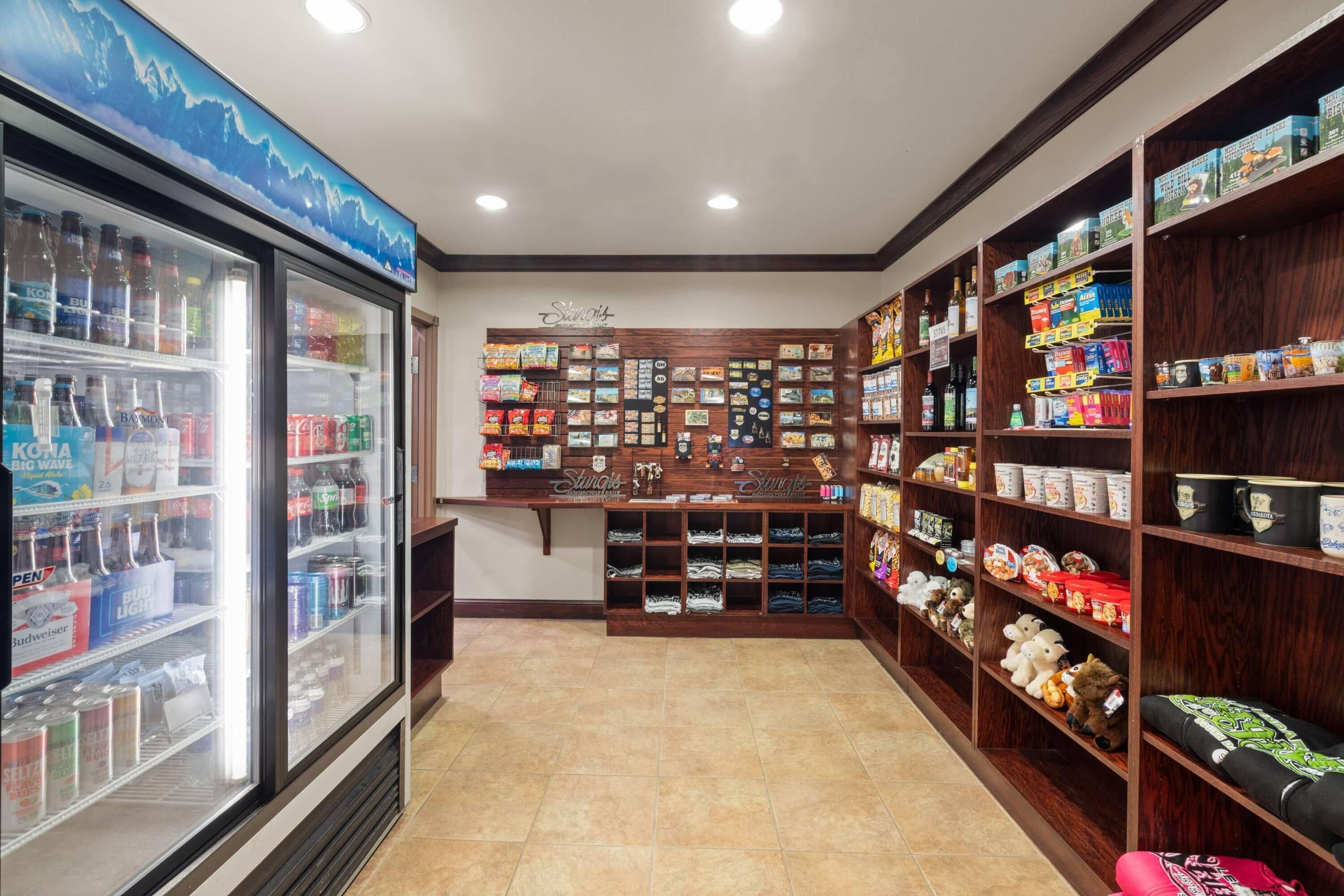 A store with shelves stocked with snacks, beverages, and souvenirs.
