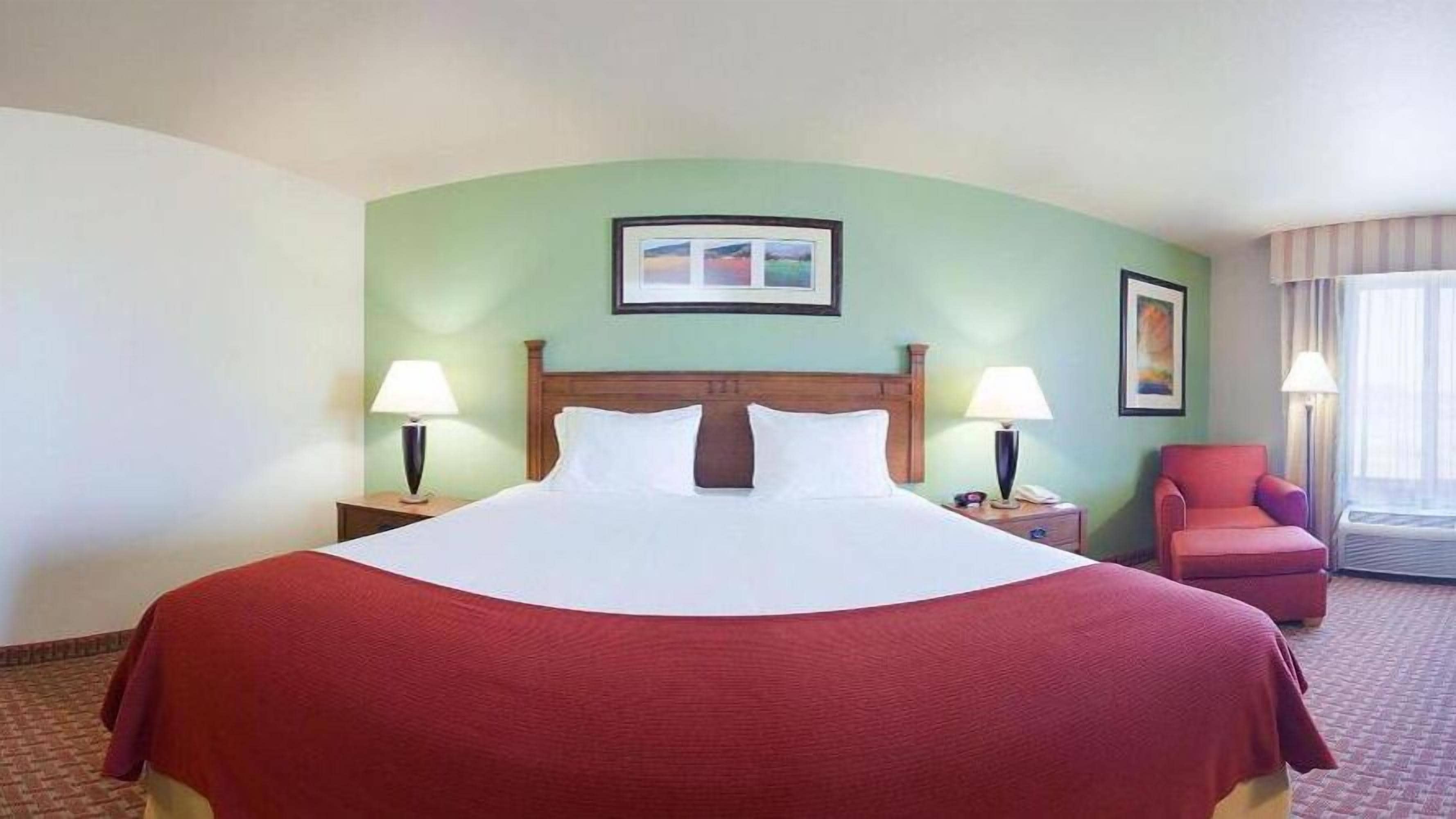 desk, blackout curtains, iron/ironing board, free cots/infant beds