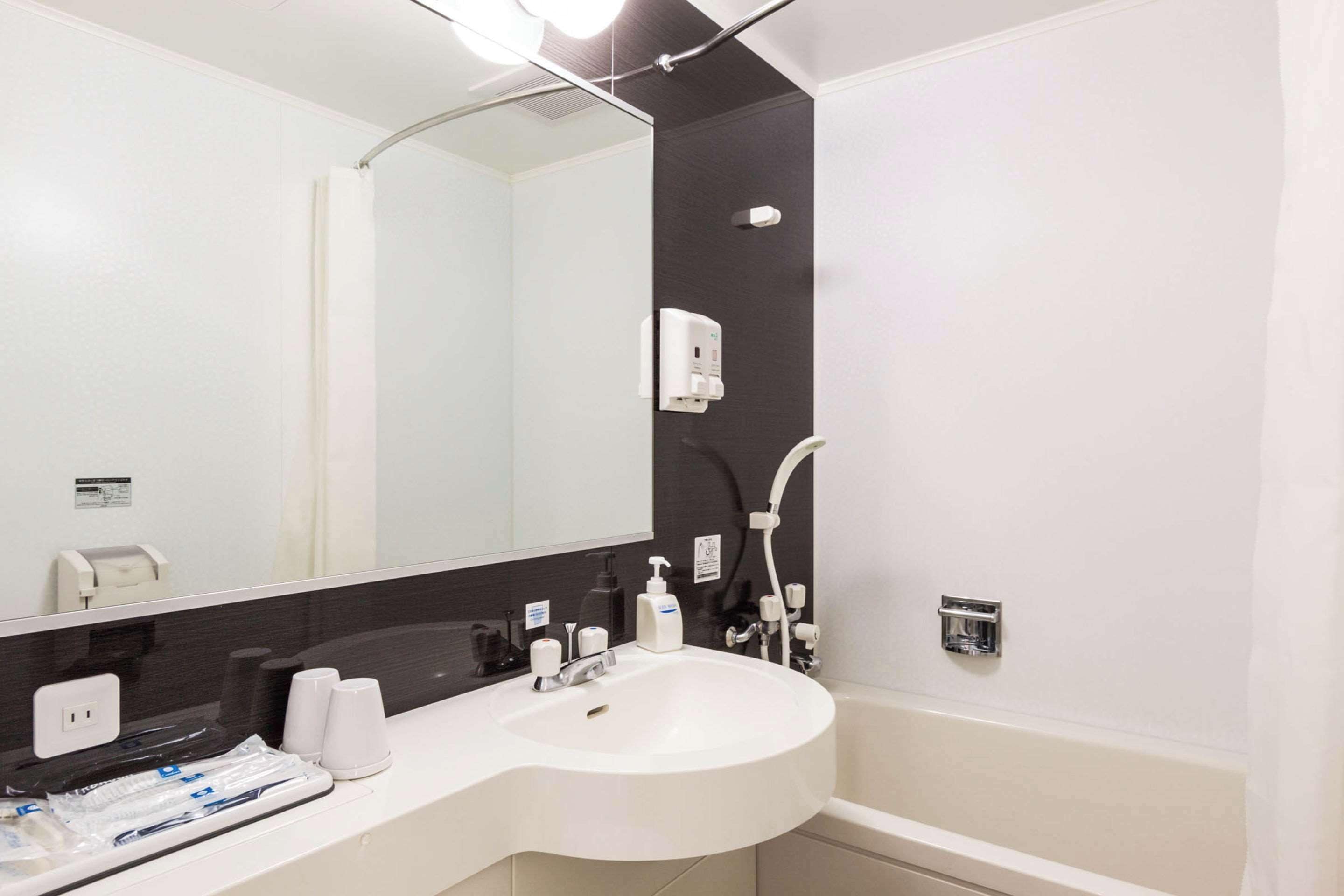 hair dryer, slippers, electronic bidet, towels