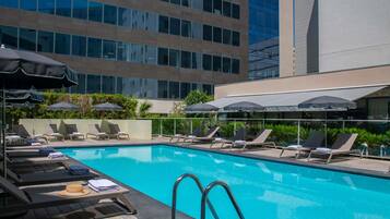 Outdoor pool, open 9:00 AM to 8:00 PM, pool umbrellas, pool loungers