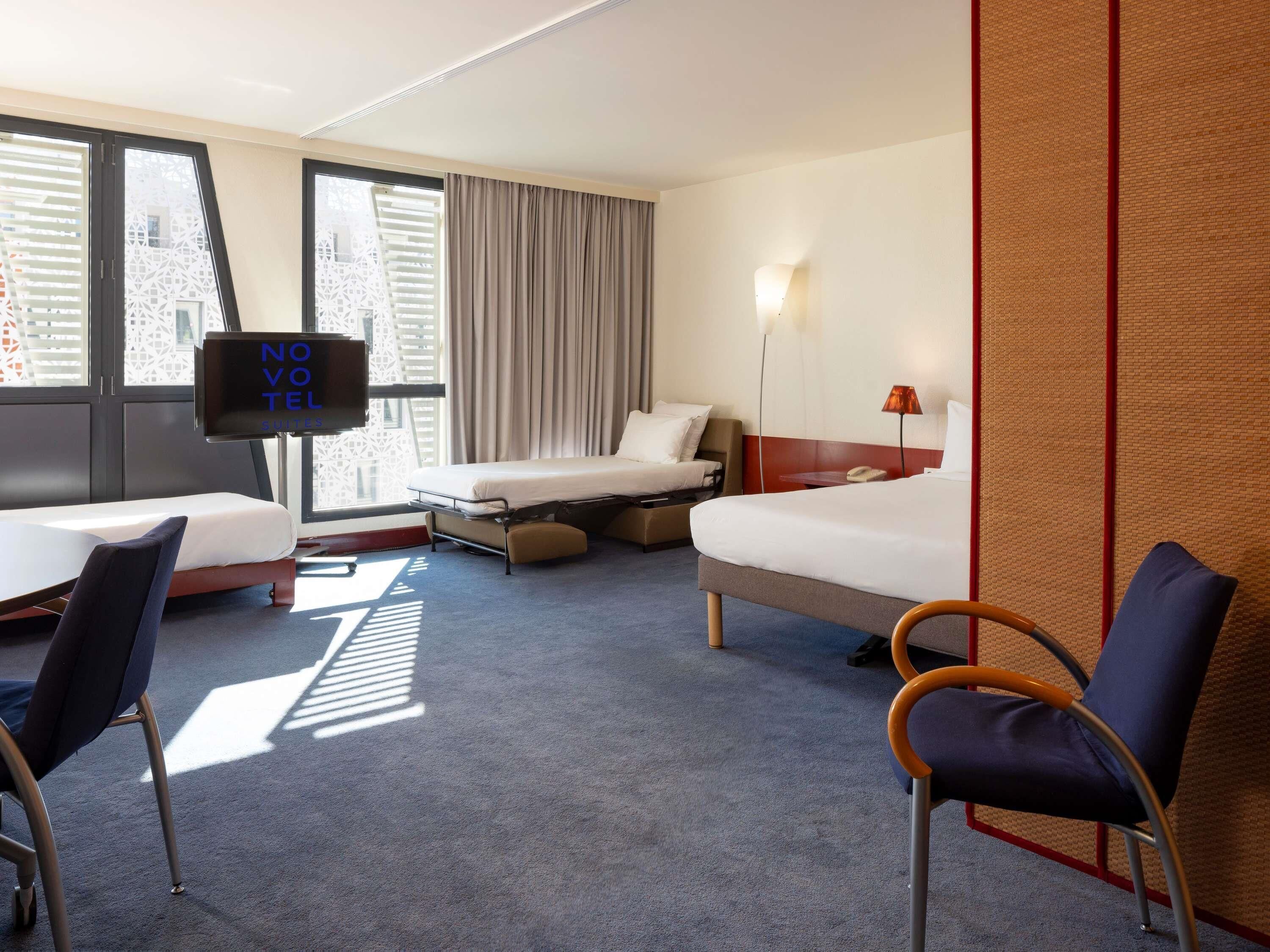 family suite, multiple beds | minibar, in-room safe, desk, laptop workspace