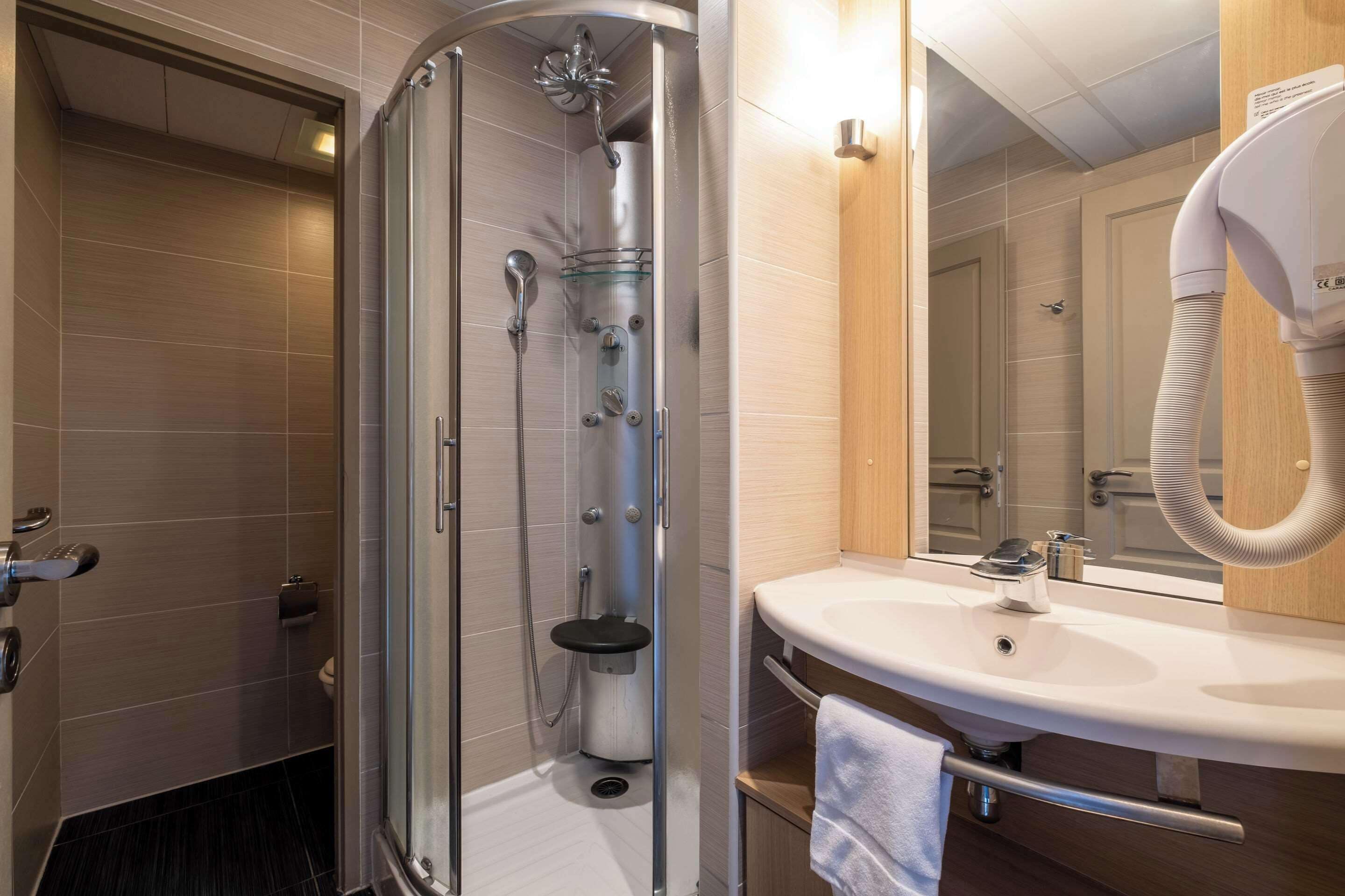 single studio - pool access | bathroom | eco-friendly toiletries, hair dryer, towels