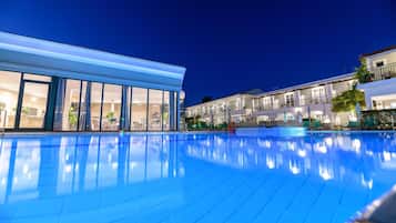 Seasonal outdoor pool, open 8:00 AM to 7:00 PM, pool umbrellas