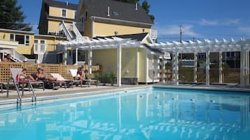 Seasonal outdoor pool, open 9 AM to 9:00 PM, pool umbrellas