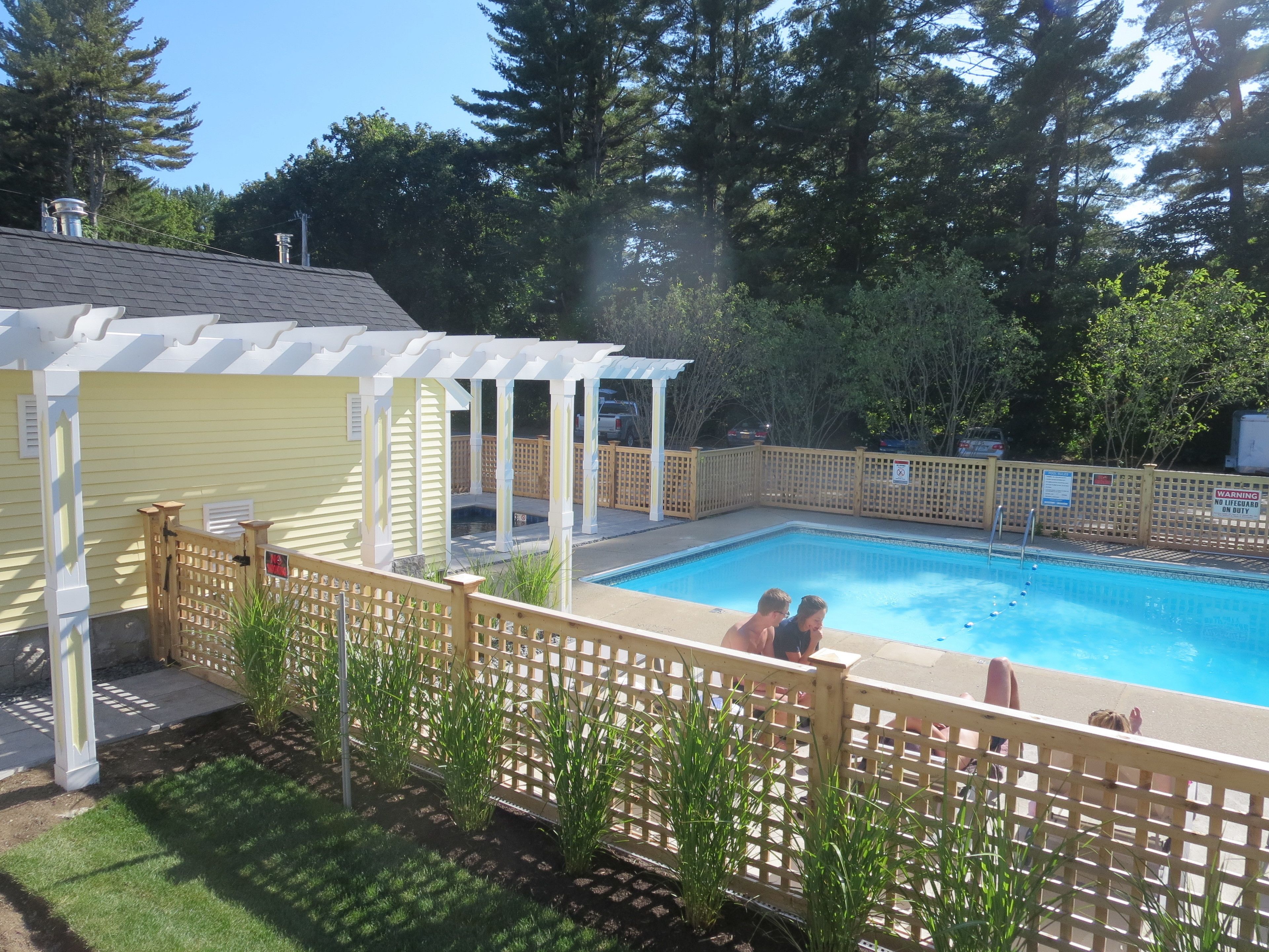 seasonal outdoor pool, open 9 am to 9:00 pm, pool umbrellas