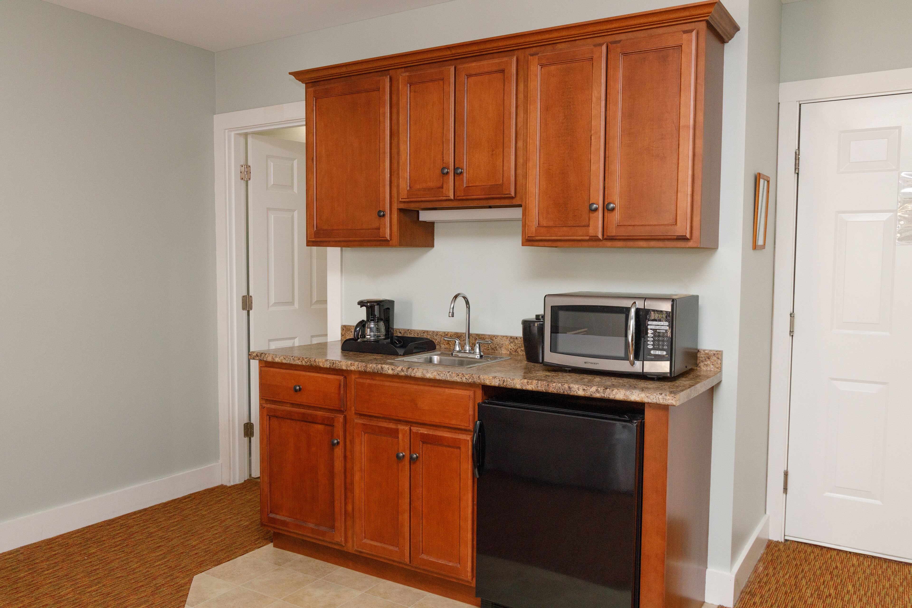 king room with wet bar and balcony | private kitchenette | fridge