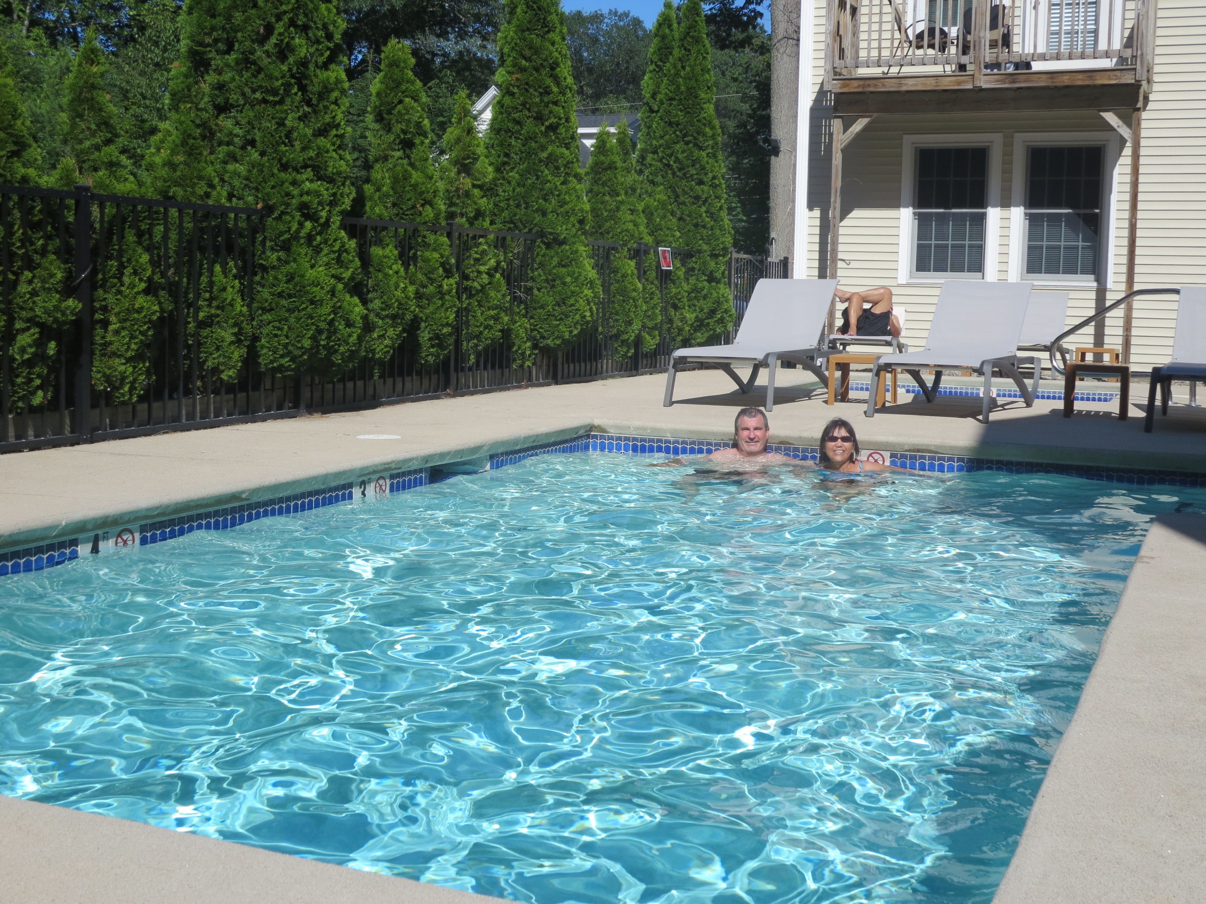 seasonal outdoor pool, open 9 am to 9:00 pm, pool umbrellas