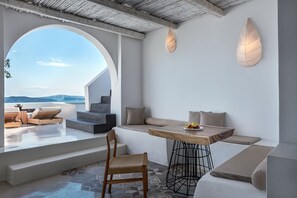 Deluxe Suite with Outdoor Hot tub | Living area | 32-inch plasma TV with satellite channels, TV, DVD player