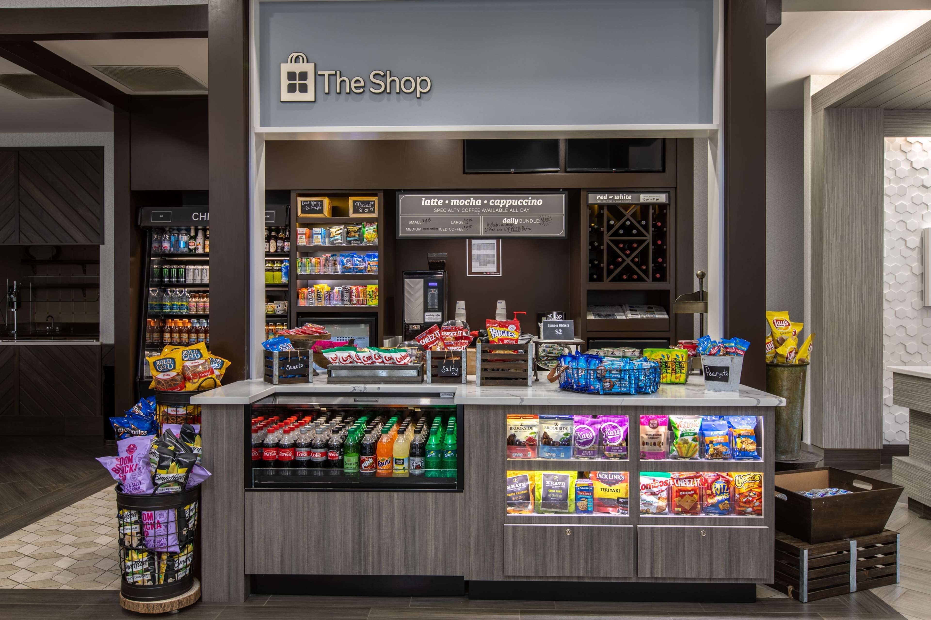 A shop with a variety of snacks, beverages, and specialty coffee.