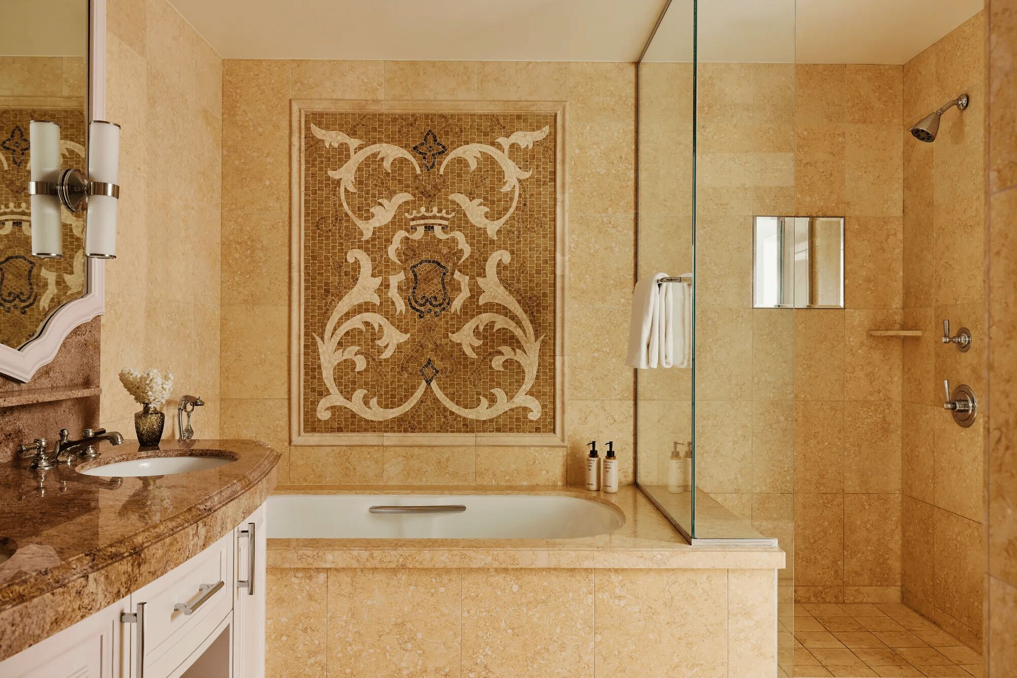 A bathroom with a large mirror, two sinks, a bathtub, and a shower.
