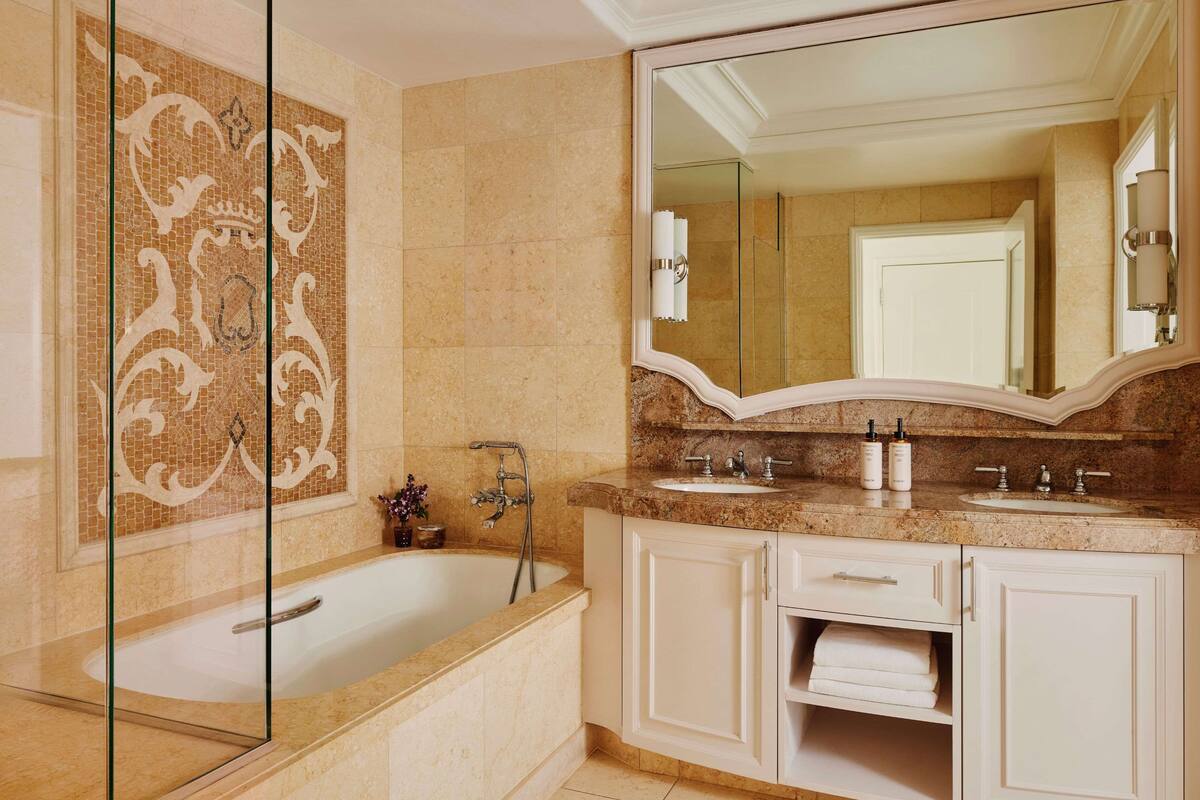 separate bathtub and shower, deep-soaking bathtub, rainfall showerhead