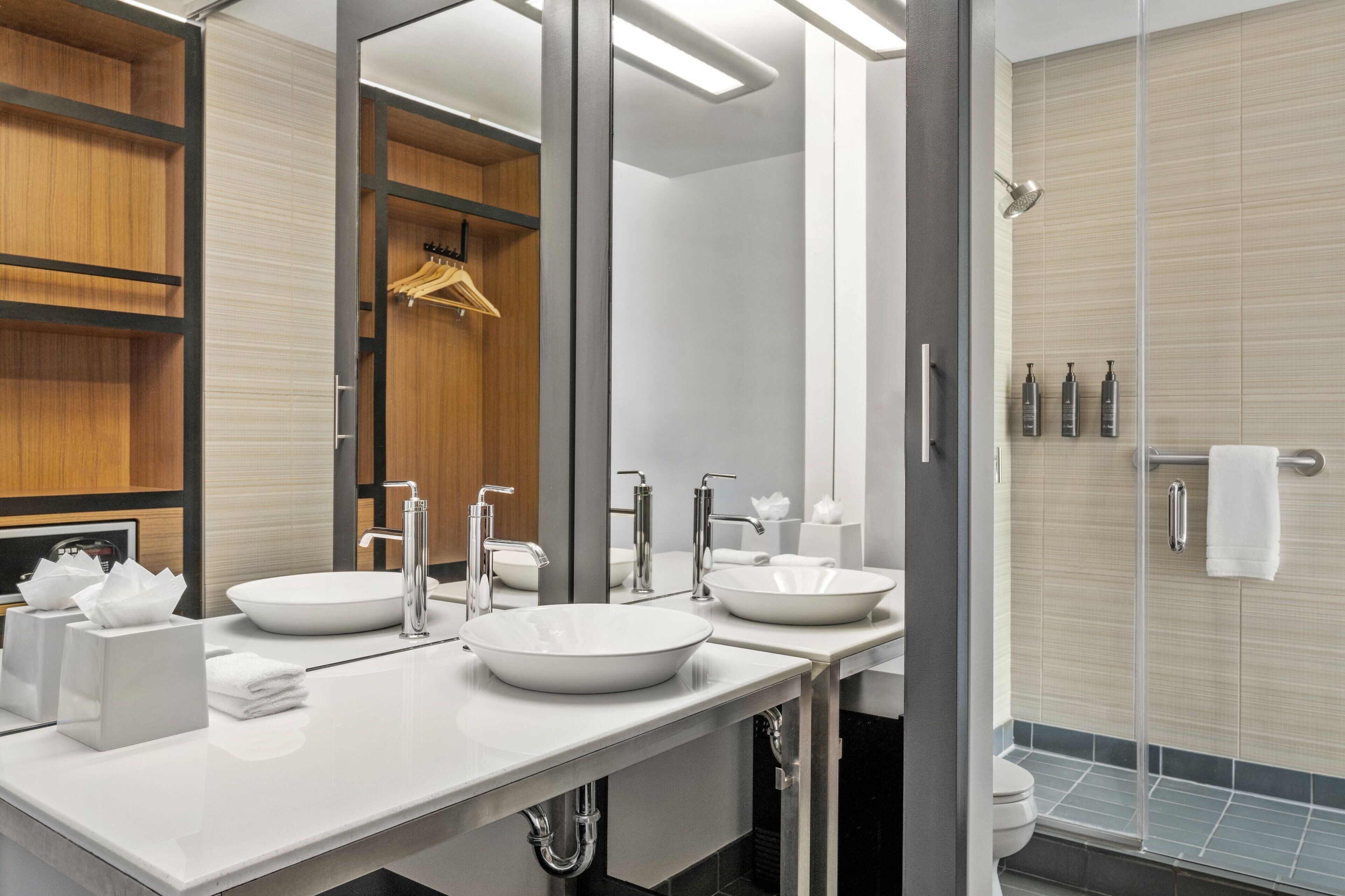 shower, designer toiletries, hair dryer, towels