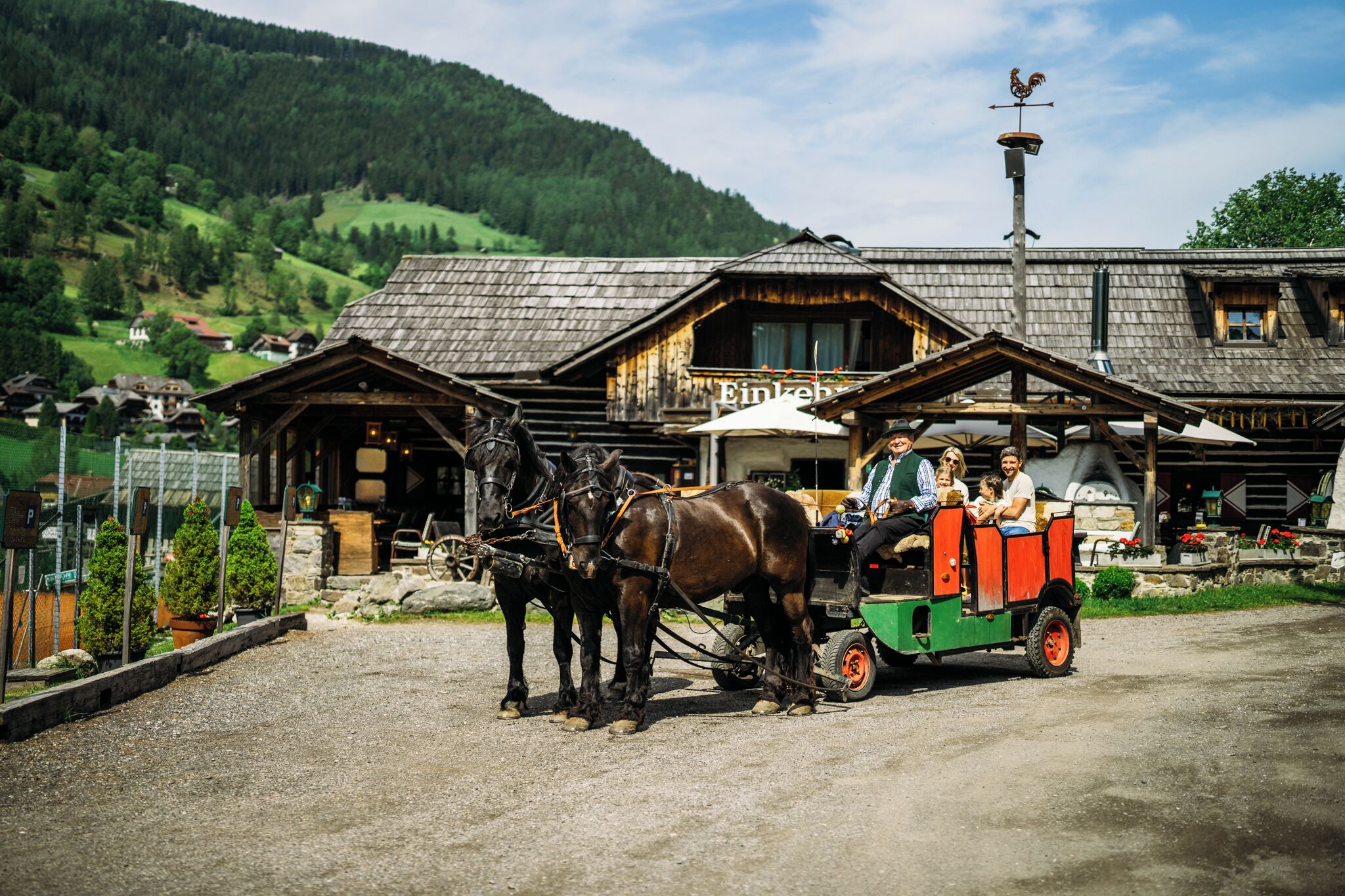 A traditional wooden building with a sign 'Einkehn'.