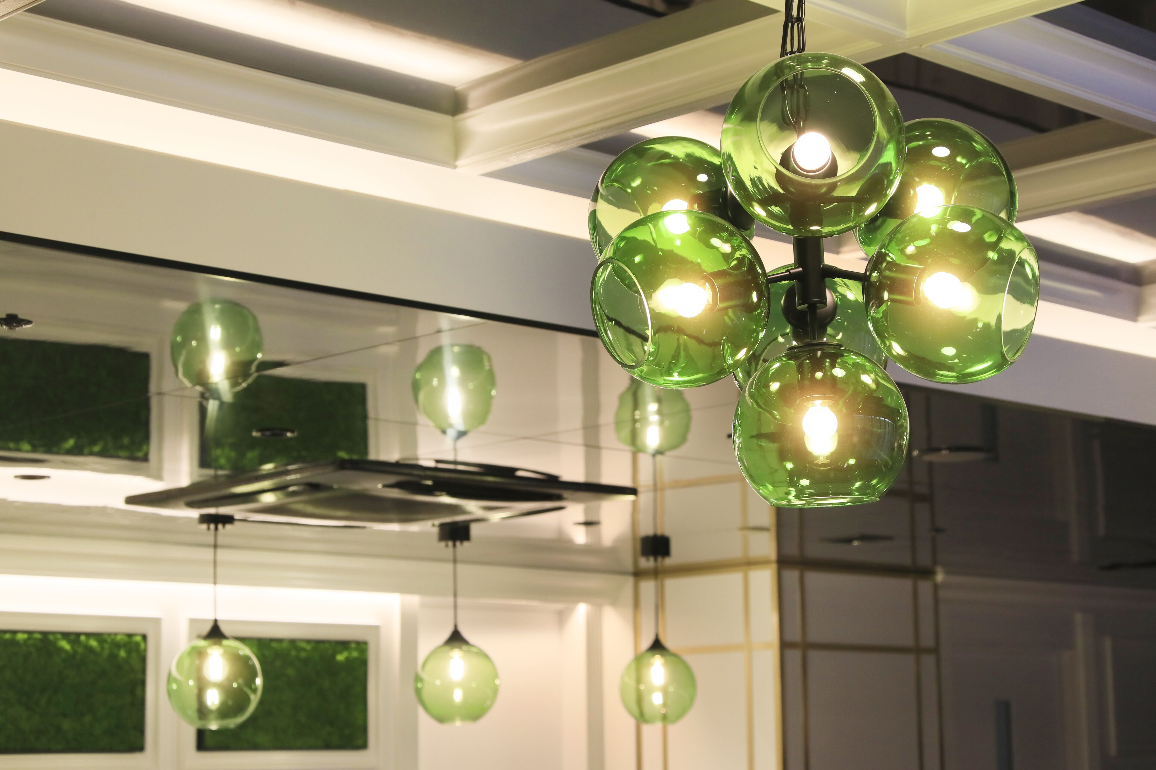 A modern chandelier with multiple spherical glass bulbs.