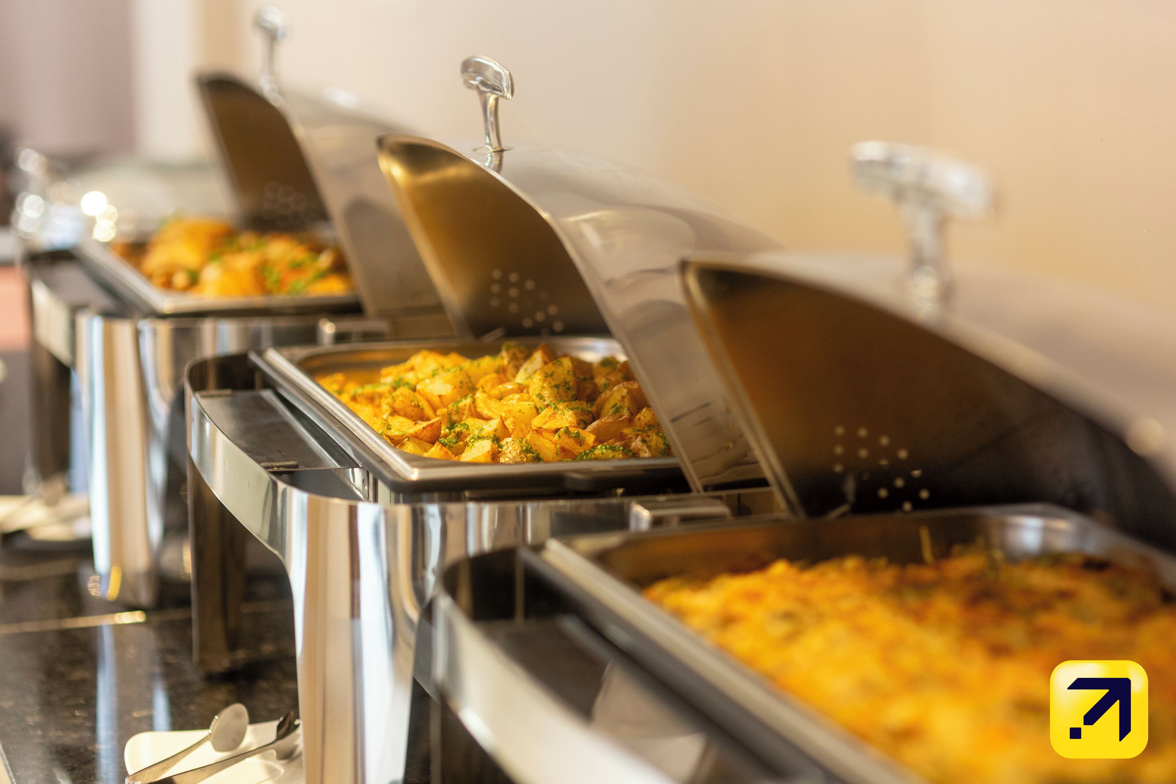 Buffet-style food service with multiple serving stations.
