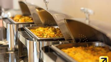 Buffet-style food service with multiple serving stations.