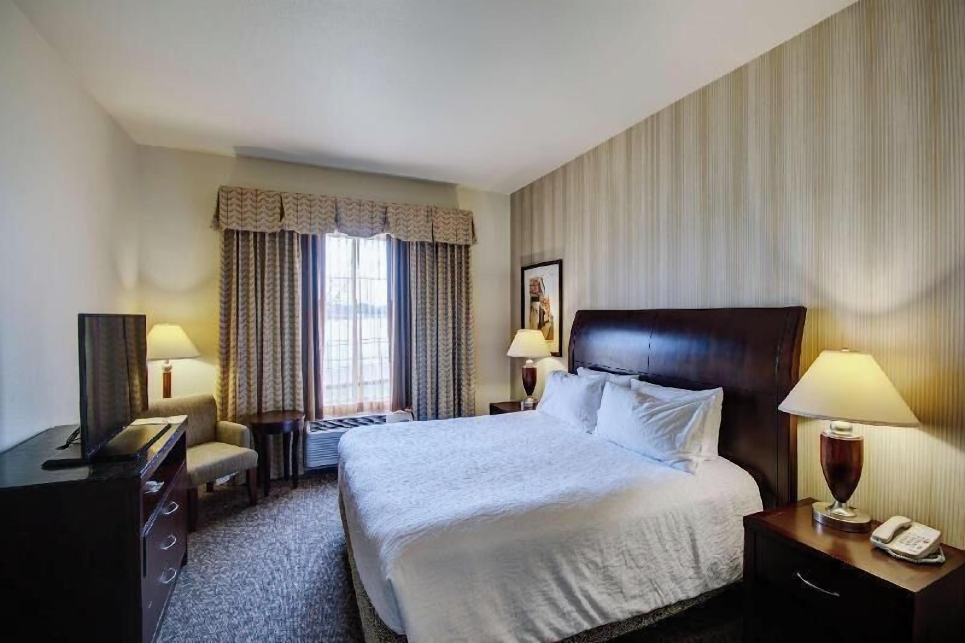 Premium bedding, down comforters, desk, laptop workspace