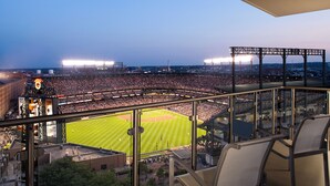 A stadium with a large seating area and a baseball field.